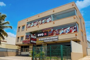 A hotel with a two-story facade, featuring a prominent 'OYO' branding and a sign for 'Sri Venkatarri Bar & Restaurant' with 'AC & NON AC' options. - HOTEL O SRI VENKATADRI ROOM (Bangalore)