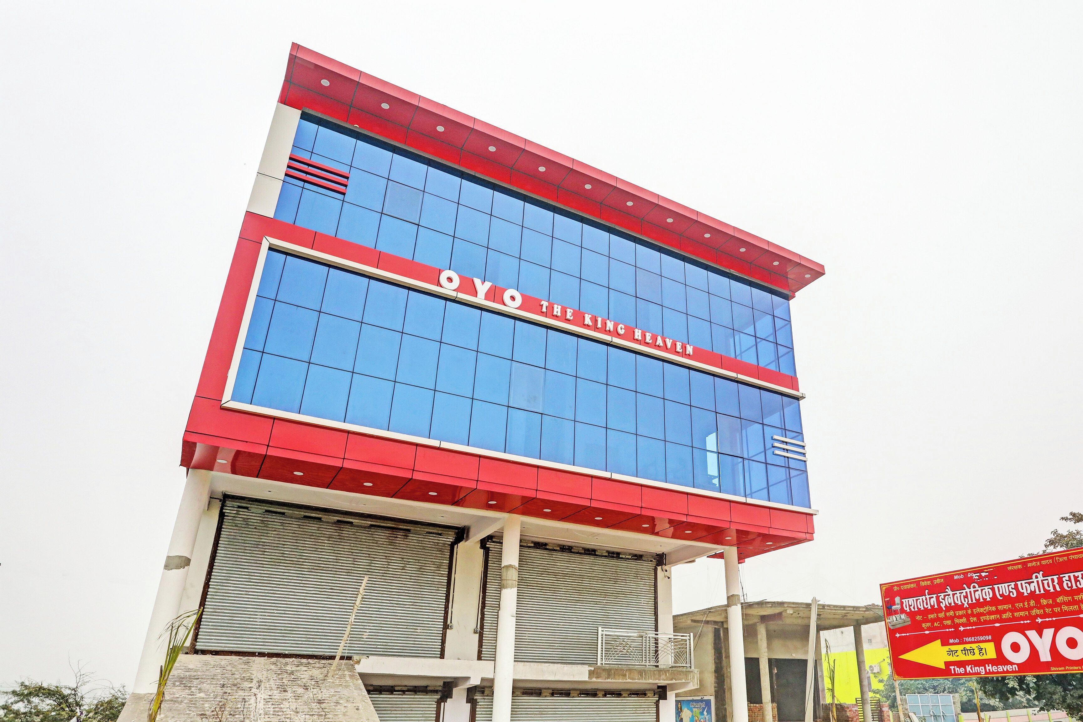 A building with a prominent sign reading 'OYO THE KING HEAVEN'.