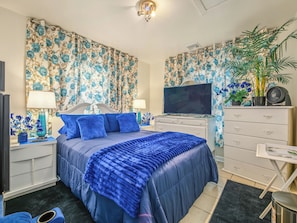 A bedroom with a bed, a television, a dresser, and a potted plant. - Private Room&Bath in Owner-Occupied Home (Bridgeport)