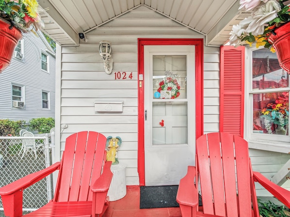 A house with a red door, numbered 1024, and a welcome mat. - Private Room&Bath in Owner-Occupied Home (Bridgeport)