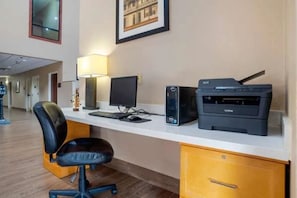 A hotel room with a desk, computer, printer, and a chair. - Comfort Inn for the Big SEC Game 5 miles to Stadium (Baton Rouge)