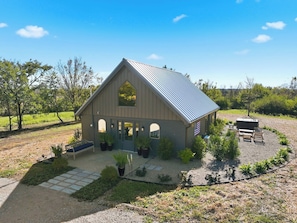 A single-story building with a gabled roof and a front porch.