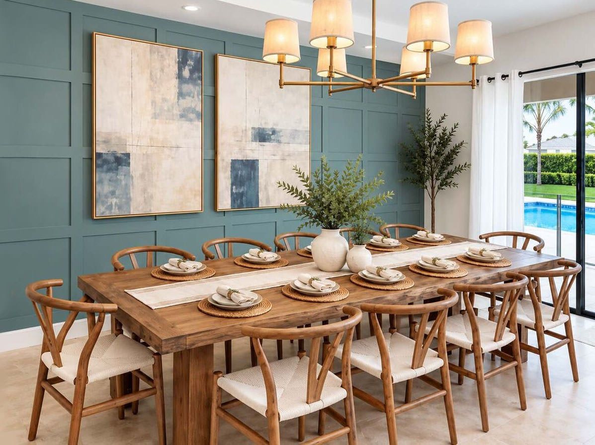 A dining area with a wooden table set for six, surrounded by chairs with cushioned seats.
