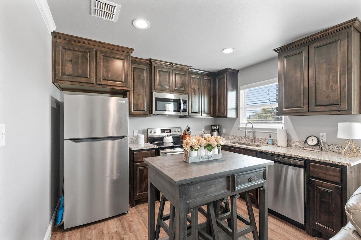 Fully Stocked Kitchen. Stainless Steel Appliances.