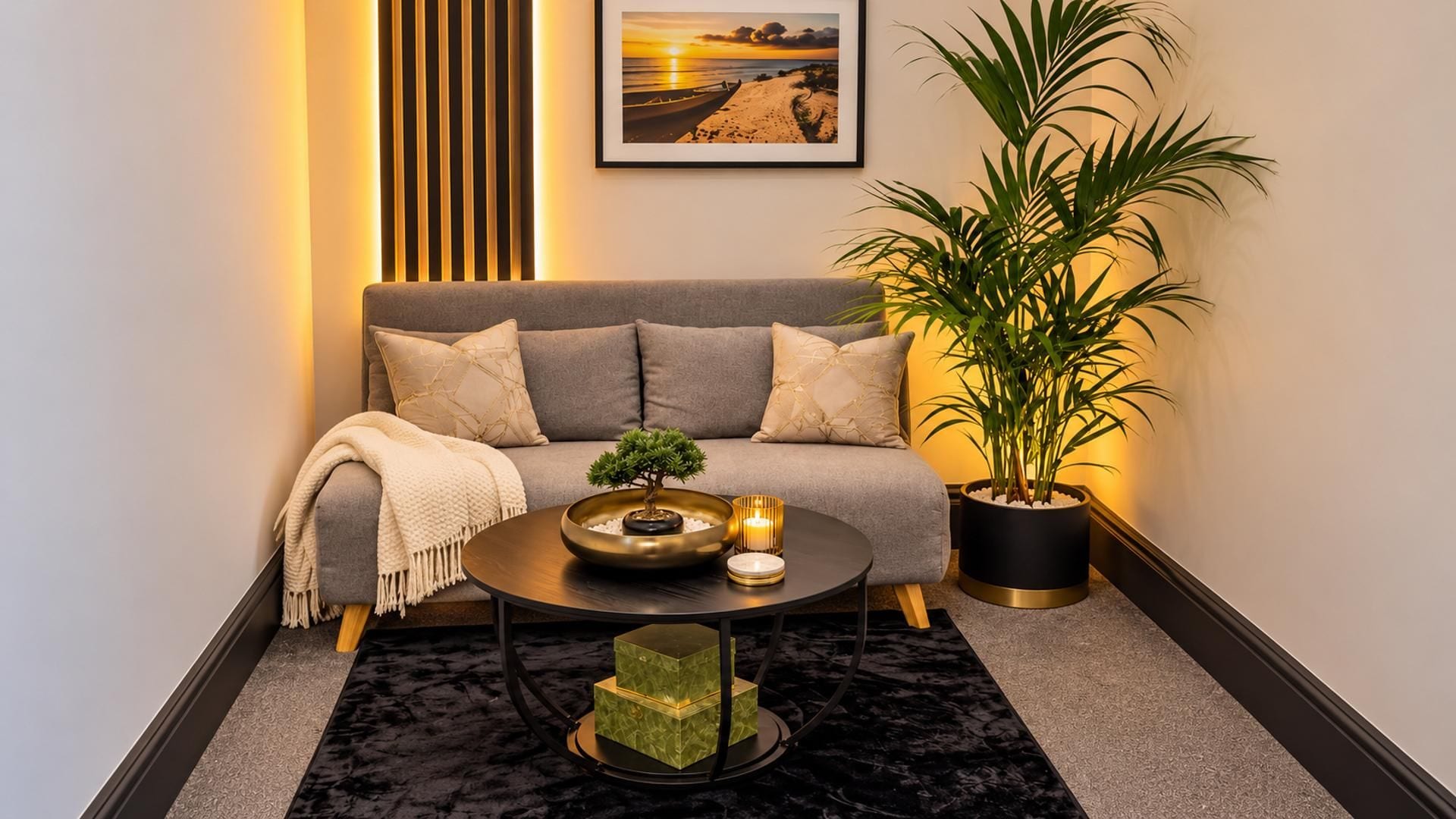 A cozy living room with a sofa, a coffee table, a bonsai tree, a potted plant, and a framed picture on the wall.