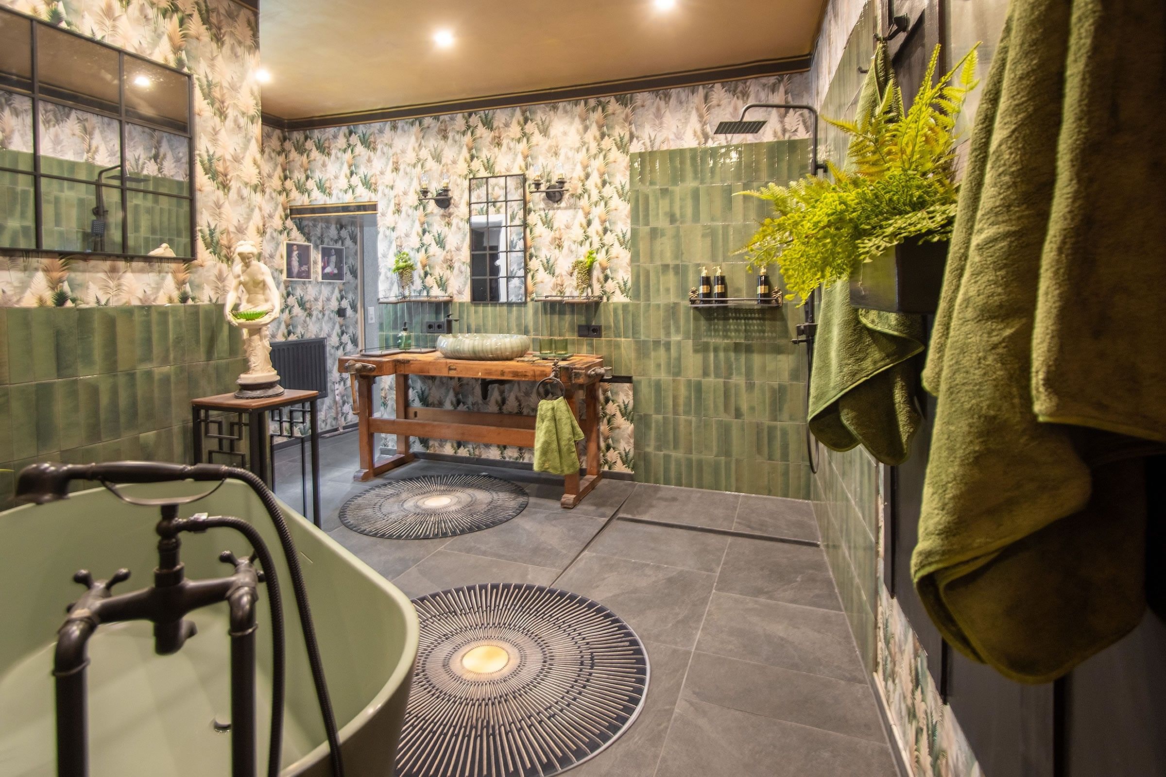 A bathroom with a bathtub, a sink, a mirror, and a towel rack.