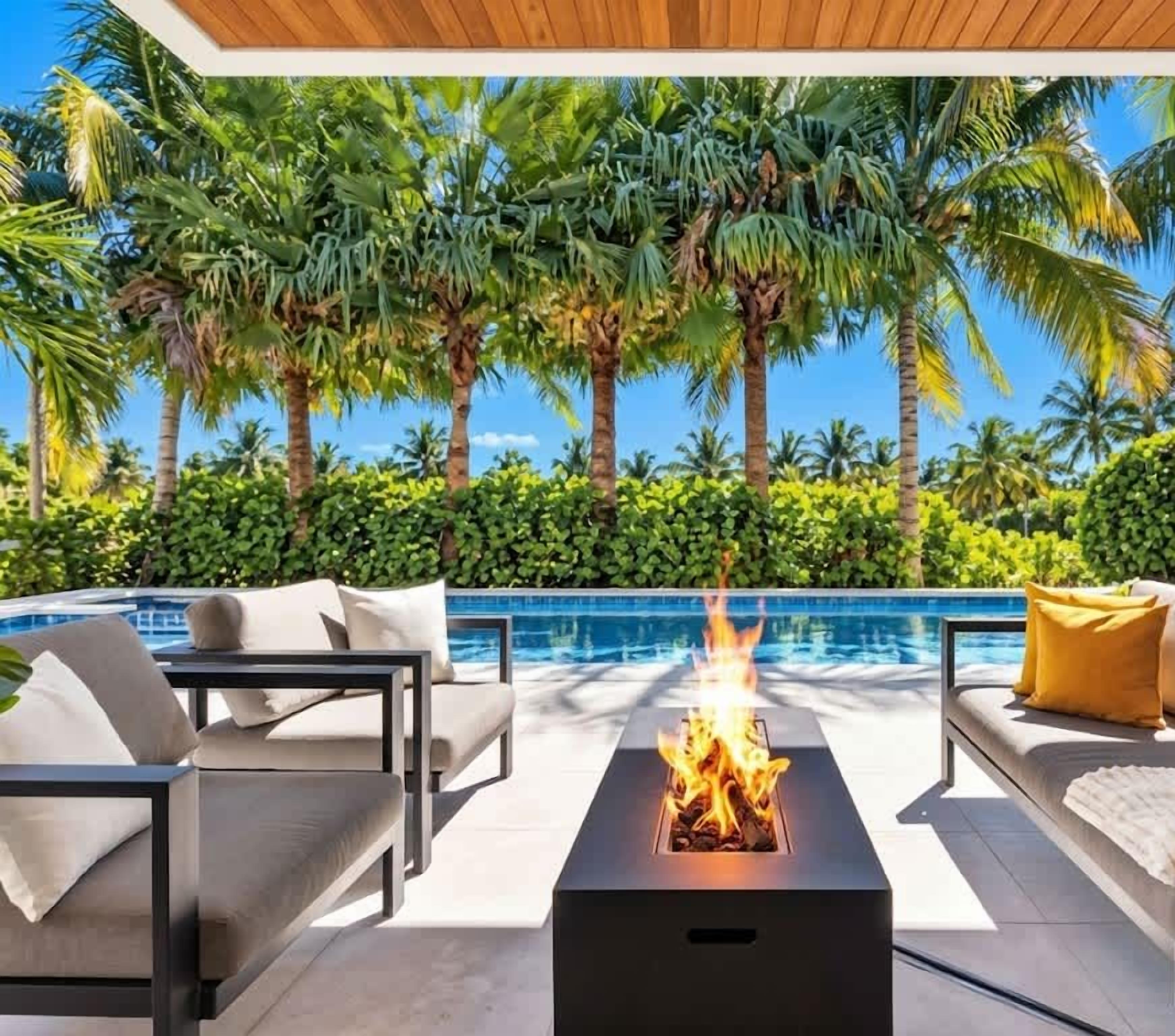 South facing pool area with Fire Pit/ Outdoor Patio with Dining, Heated Pool & Hot Tub. 