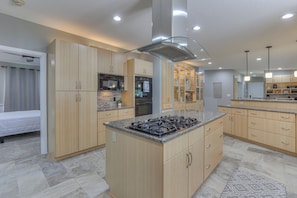 A modern kitchen with granite countertops, stainless steel appliances, and wooden cabinetry. - Just a short path to the lake! Private dock! 4 BR 4 BA (Estill Springs)