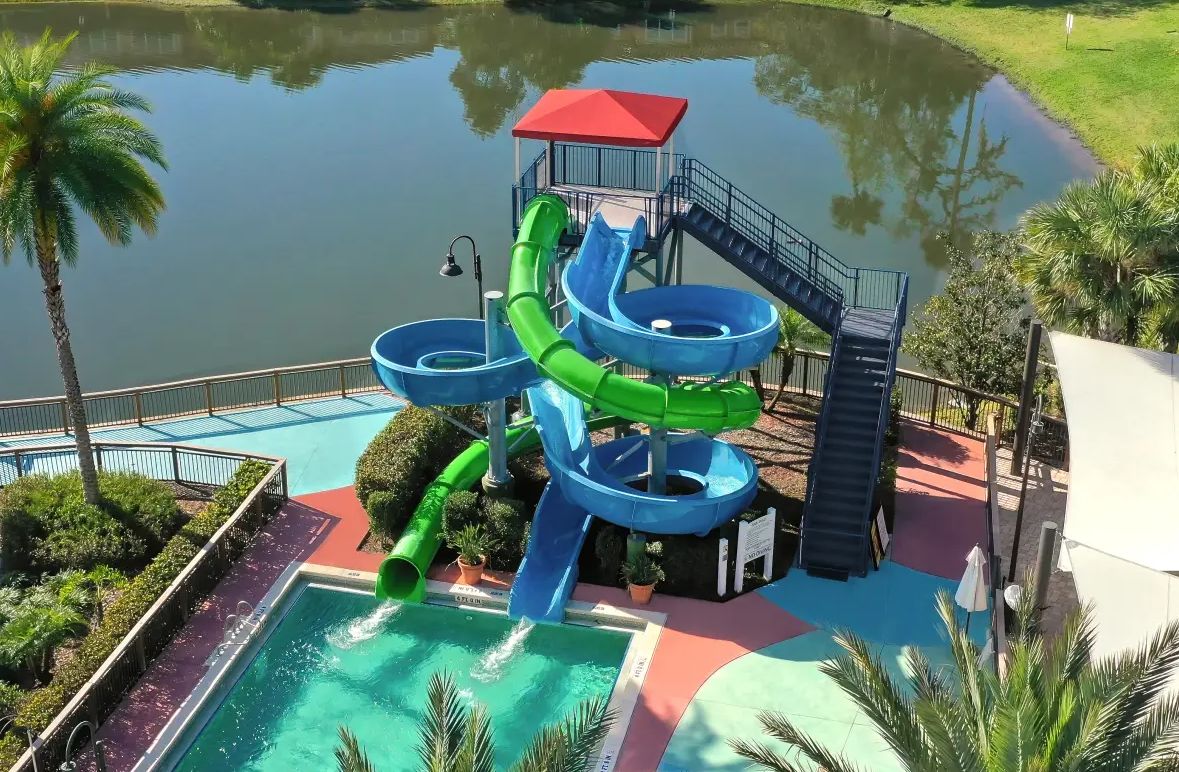 A water park with multiple slides and a pool area.