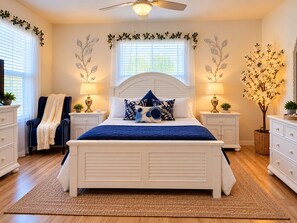 A bedroom with a bed, two nightstands, a chair, and a decorative tree. - Paradise in Spanish Springs 2/2/1.5 garage w/ 4-seat gas golf cart. Pet friendly (Lady Lake)