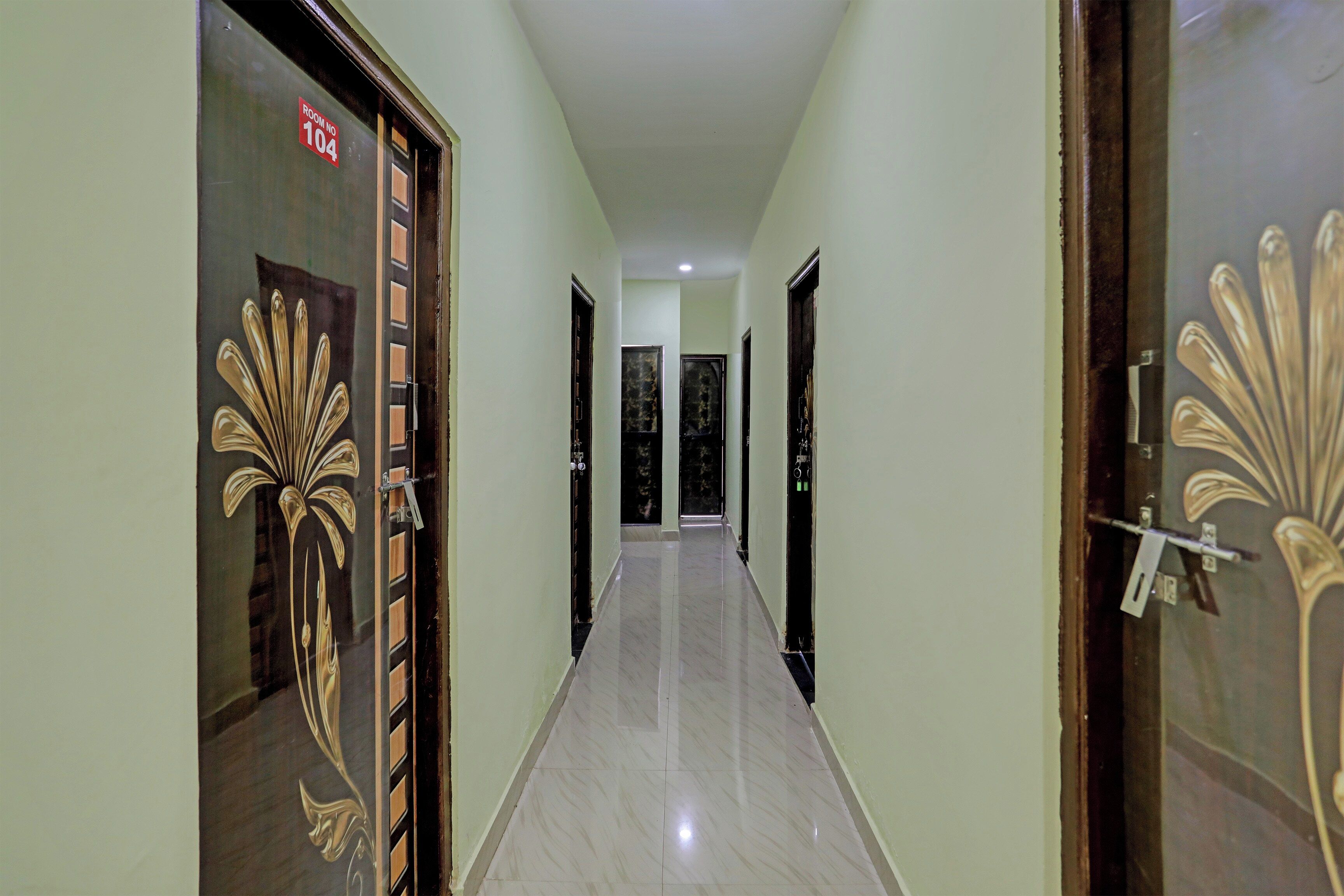 A corridor with doors on both sides, each with a unique design.