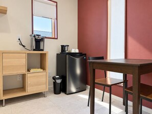 A compact kitchenette with a coffee machine, a refrigerator, and a trash bin. - Private 1BR Suite near Steveston | Living Room, No Kitchen (Richmond)