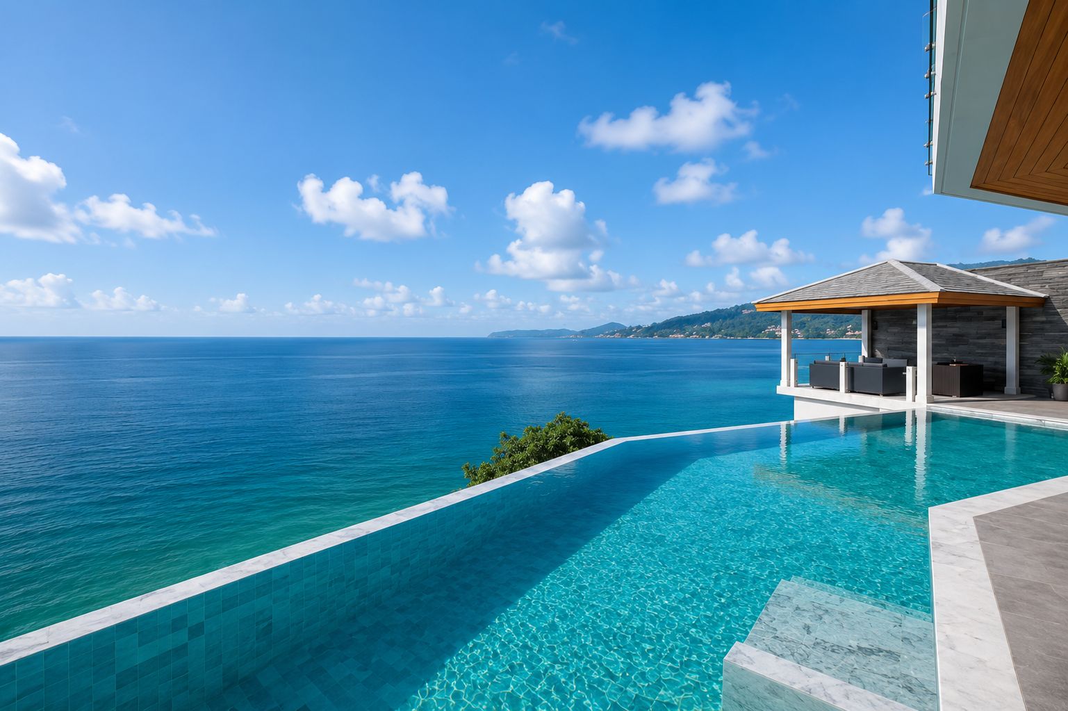 An infinity pool with a clear view of the sea and a covered seating area with outdoor furniture.