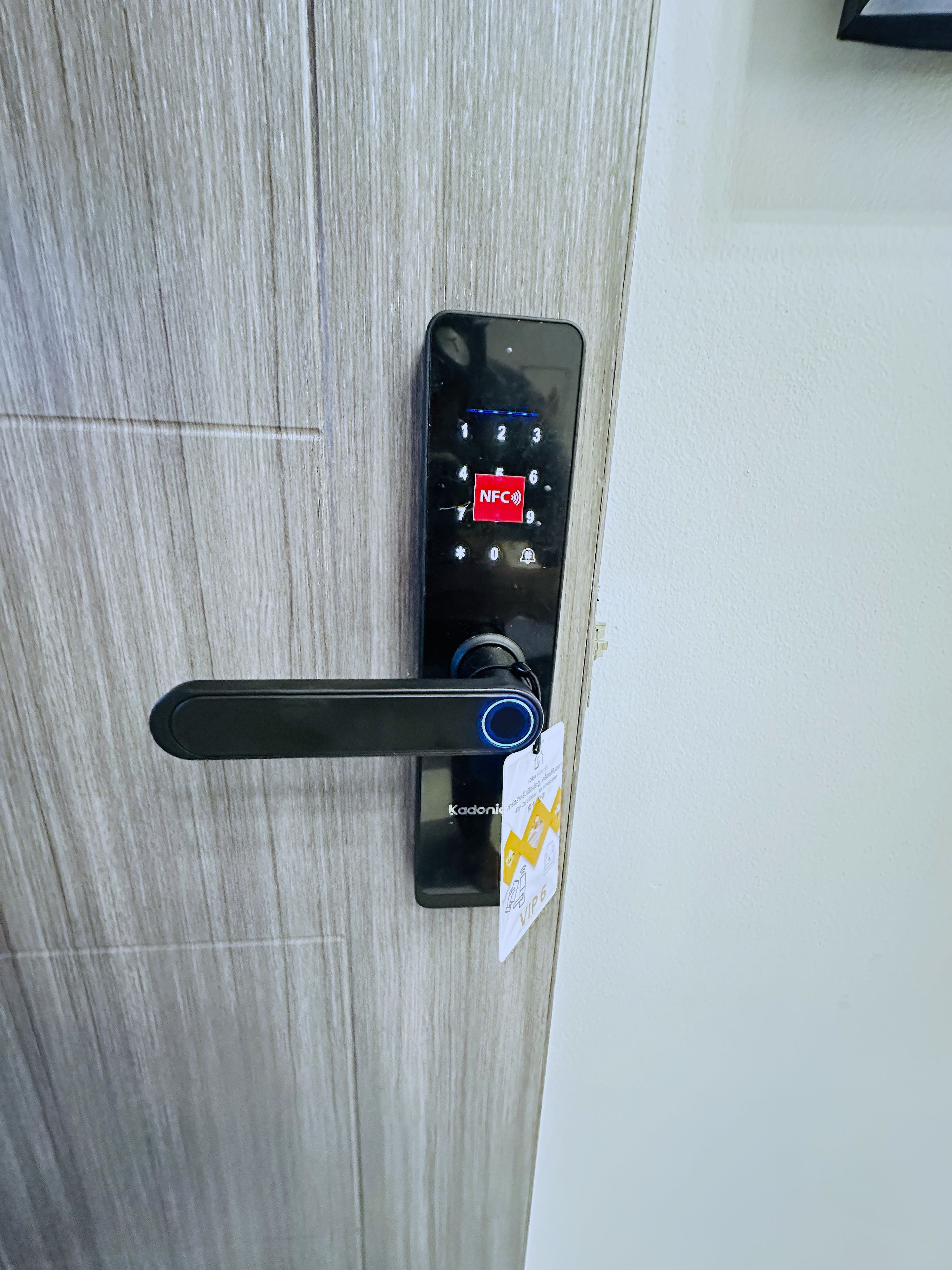 A door with a keypad and a card reader, indicating a secure entry system.