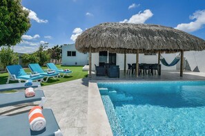 Relax in the private gazebo and unwind by the pool on comfortable loungers, complete with an outdoor shower. - Luxury 4BR Villa • Pool • Walk to Palm Beach (Noord)