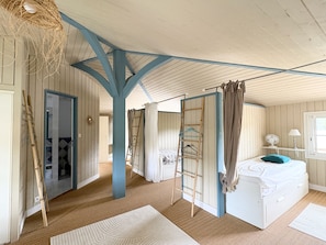 A room with a bed, a fan, a window, and a door. - New Listing (La Teste-de-Buch)
