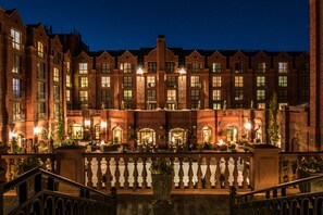A multi-story hotel with a brick facade, outdoor seating, and a balcony with railings. - St Regis Aspen Residence Club, Super Lux 2 Bedroom, 2.5 Bath Residence (Aspen)