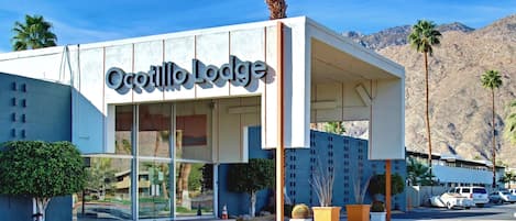 The exterior of the Ocottillo Lodge with a clear view of the entrance and surrounding landscaping.