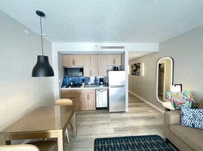 A modern apartment with a kitchen, dining area, and living space. - Studio @ Divi Village -Infinity Pool! (Oranjestad)