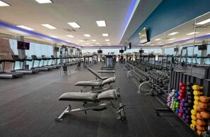 A gym with treadmills, weight benches, and a variety of dumbbells. - Studio @ Divi Village -Infinity Pool! (Oranjestad)