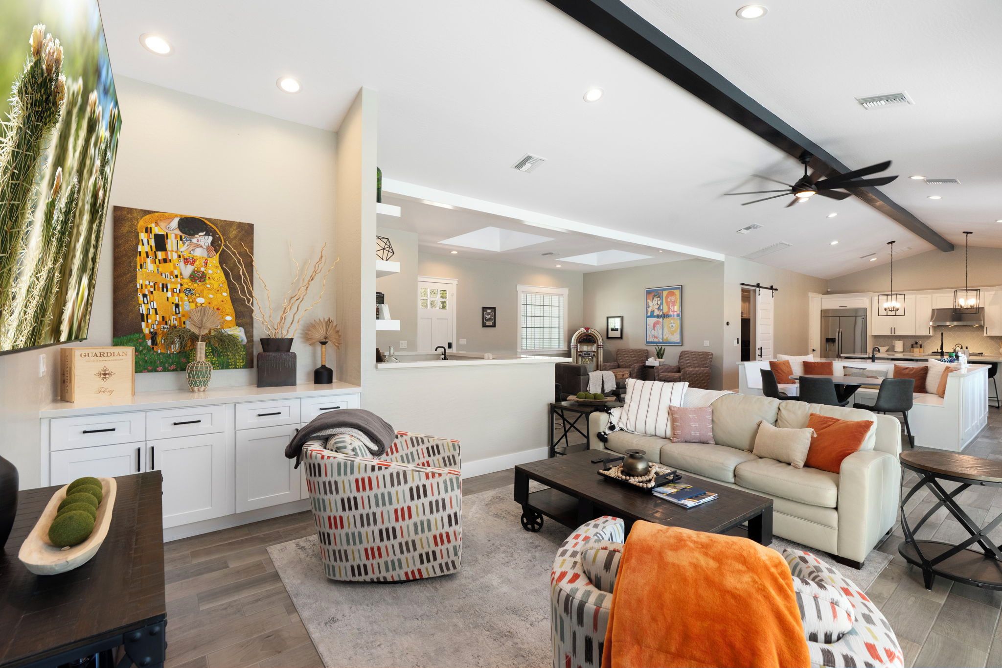 A modern living room with a sofa, coffee table, and decorative items.