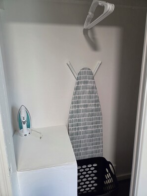 A laundry area with an iron, a drying rack, and a basket. - 3 bdrm house! Unbeatable Location! Close to Everything: Wind Rock, Melton Hill! (Clinton)
