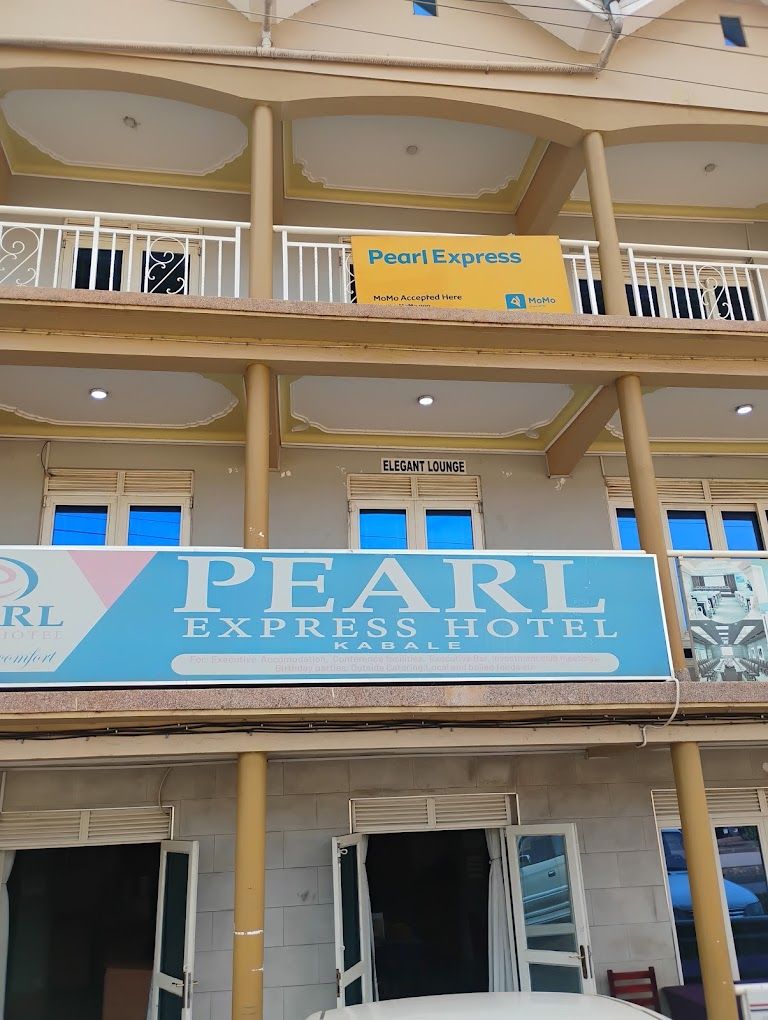 A multi-story hotel with a sign for 'Pearl Express Hotel' and a 'Pearl Express' sign above the entrance.