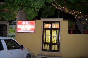 A hotel sign for 'HOTEL RAJA PALACE' with a website URL. - Raja Palace (Jaisalmer)