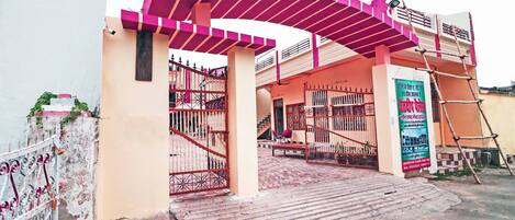 A gated entrance with a ramp leading to a building.