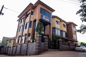 A multi-story hotel with a prominent sign for 'Gold Hotel.' - Hulcity Gold Hotel (Kampala)