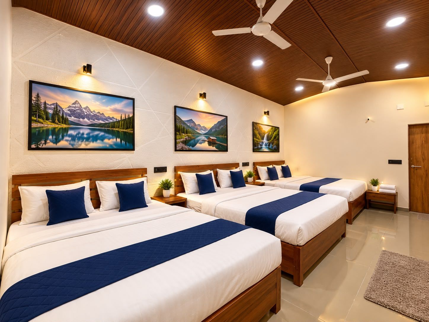 A hotel room with four beds, wooden headboards, and a ceiling fan.