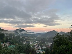 A mountainous landscape with a town nestled in the valley. - Yasnaya camps (Farsoli)
