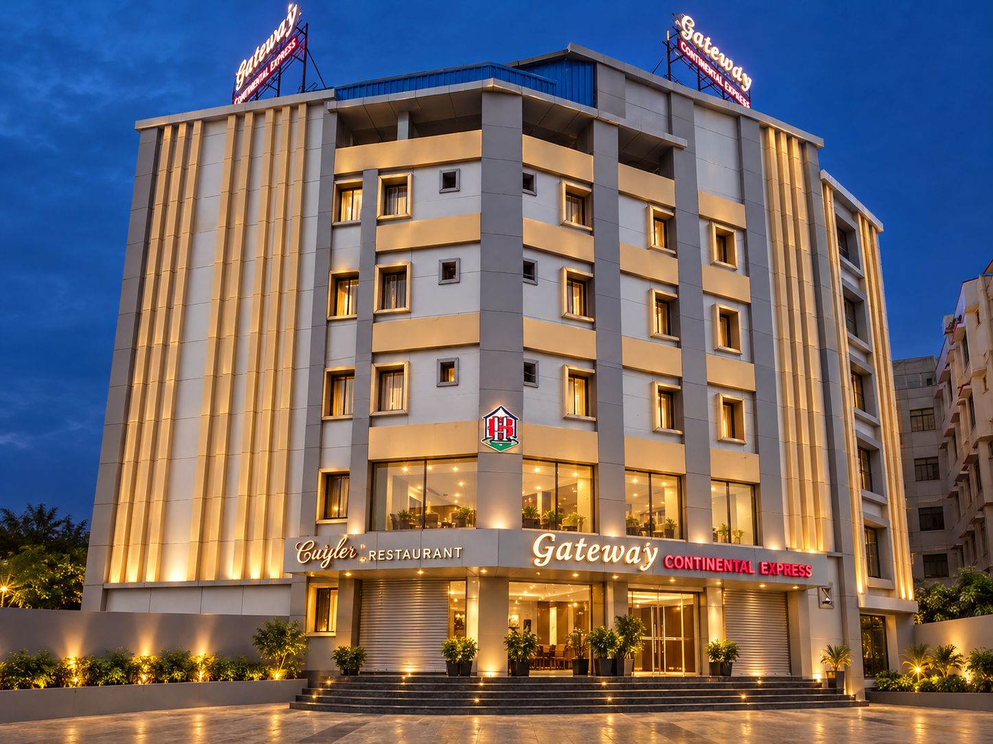 A multi-story hotel with a restaurant named 'Cujler Restaurant' and a 'Gateway Continental Express' sign.