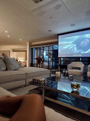 A modern living room with a large flat-screen TV, a glass coffee table, and a sofa. - New Listing (Rio de Janeiro)