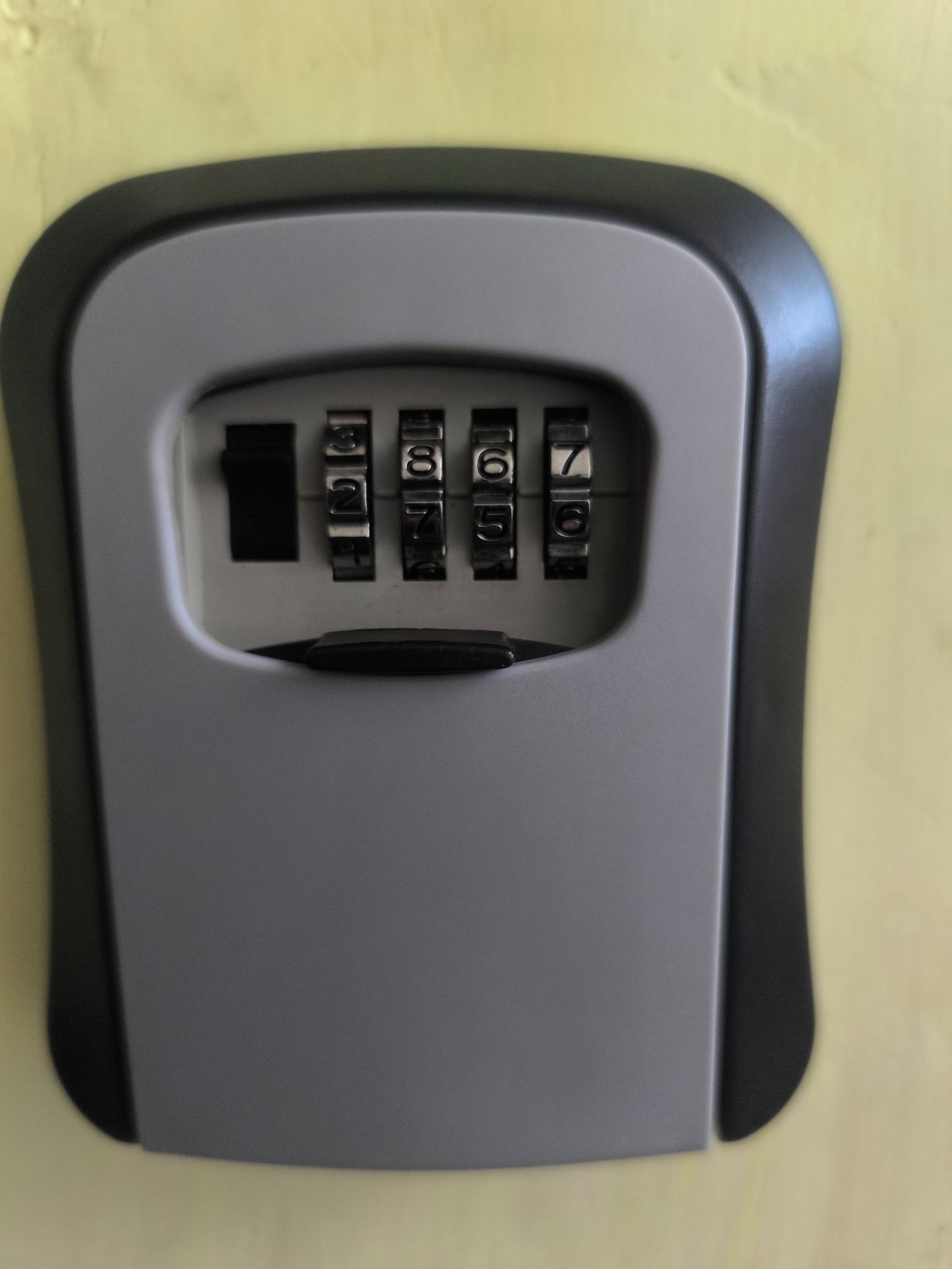 A keypad lock on a door.