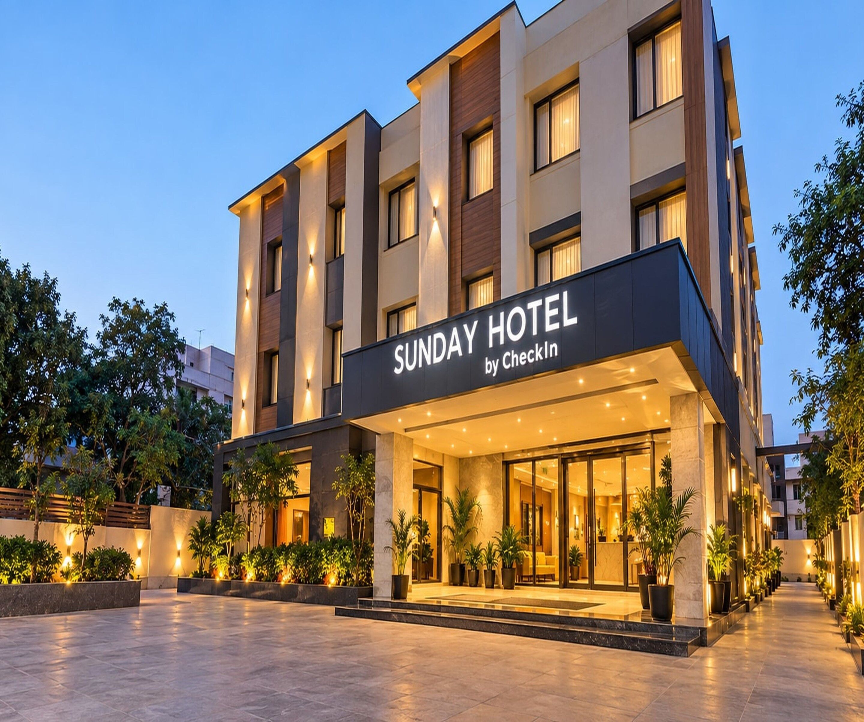 A modern hotel building with a sign reading 'SUNDAY HOTEL by CheckIn'.