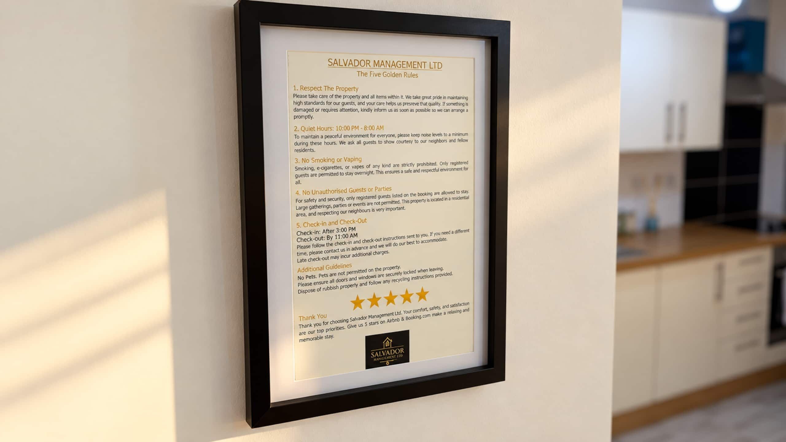 A framed sign with the Five Golden Rules of Salvador Management Ltd.