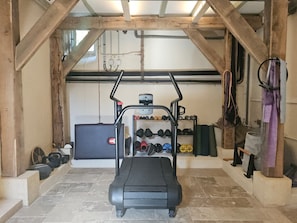 A gym with a treadmill, weight racks, and exercise equipment. - New Listing (Val de Louyre et Caudeau)