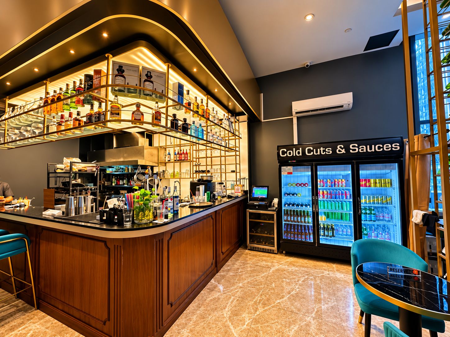 A bar area with a liquor display and a cold cuts & sauces refrigerator.