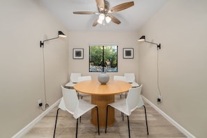 Cozy dining area, just off the kitchen, with table that comfortably seats six