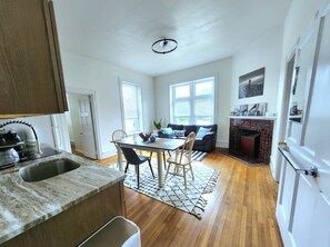 A modern kitchen with a granite countertop and a built-in sink. - Bryn Mawr 1st Floor Apartment / Near Villanova (Bryn Mawr)
