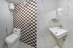 A bathroom with a toilet, bidet, and sink. - Hotel O Willows Hotels (Gurugram)
