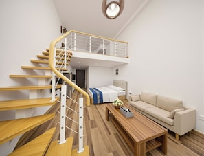 A modern living space with a wooden staircase, a sofa, a coffee table, and a bed. - Junyi Scenic Apt Shilaoren Intl Expo (Qingdao)
