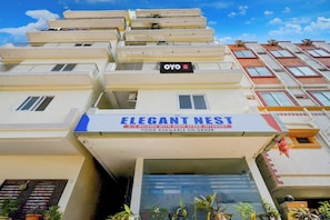 A hotel named 'ELEGANT NEST' with a sign indicating A/C rooms with high-speed internet and food available on order. - Hotel O by OYO ELEGANT NEST Lemon Tree (Hyderabad)