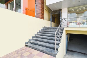 A staircase with metal railings leading to a lower level. - HOTEL O SVR GRAND (Hyderabad)
