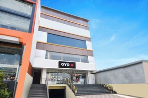 A modern hotel building with a sign reading 'OYO Hotel SVR Grand'. - HOTEL O SVR GRAND (Hyderabad)