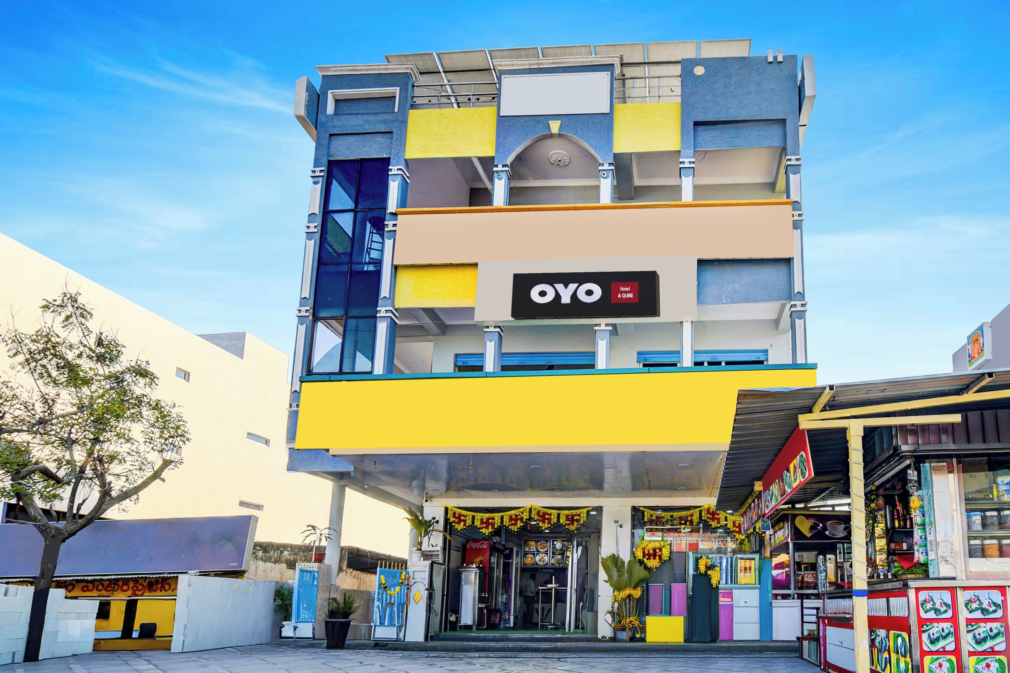 A multi-story hotel building with a prominent 'OYO Hotel' sign.