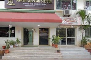 The Raga Grand Hotel with a sign for the Trishala Authentic Indian Restaurant. - Hotel O RAGA GRAND HOTEL (Hyderabad)