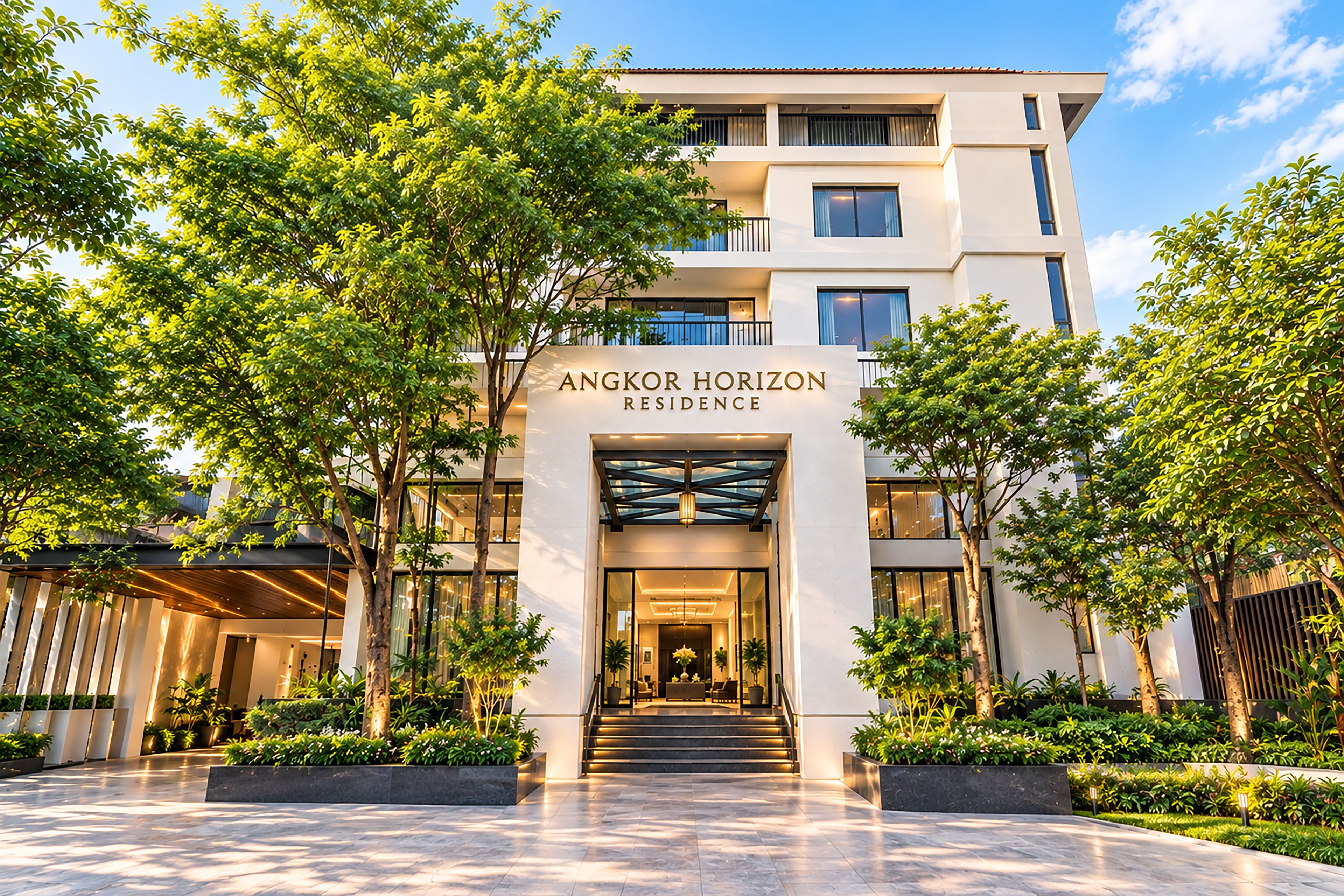 A modern multi-story building with a sign reading 'Angkor Horizon Residence.'