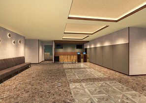A modern lobby with a reception desk, seating area, and patterned flooring. - Natural Hot Spring Matsubara no Yu (Rikuzentakata)